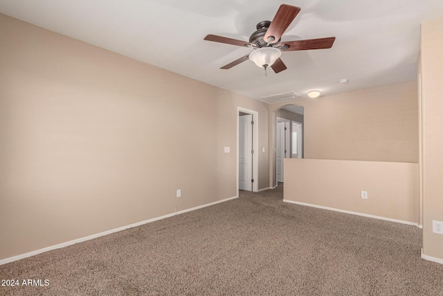 carpeted empty room with ceiling fan