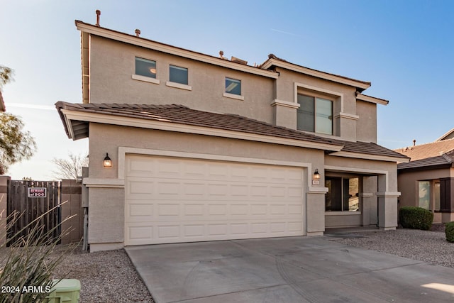 view of front of property with a garage