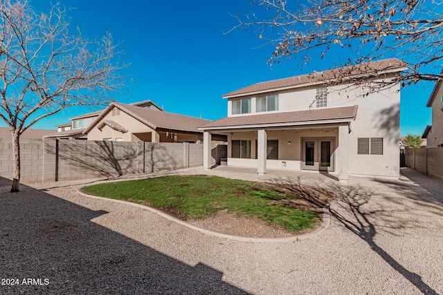 rear view of house with a patio