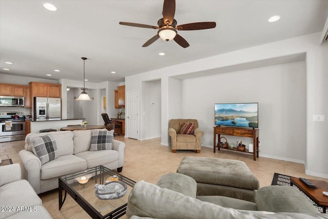 tiled living room with ceiling fan