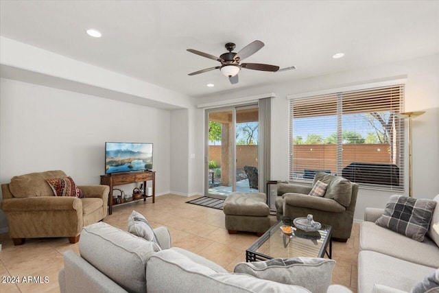 living room with ceiling fan and light tile patterned floors