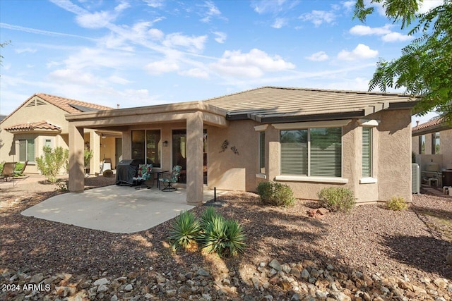 rear view of house featuring a patio area