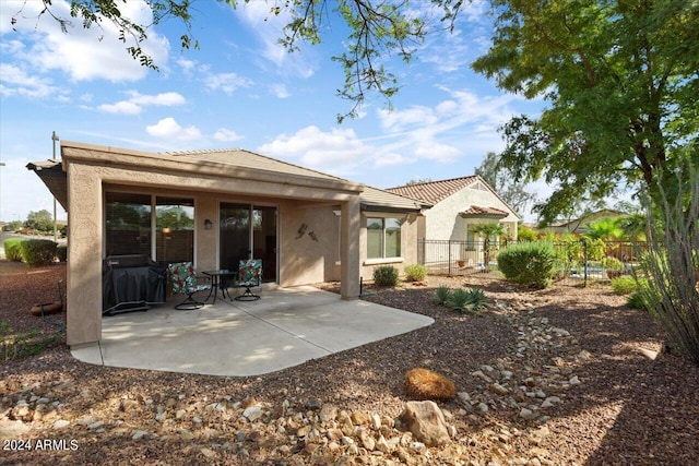 rear view of house featuring a patio area