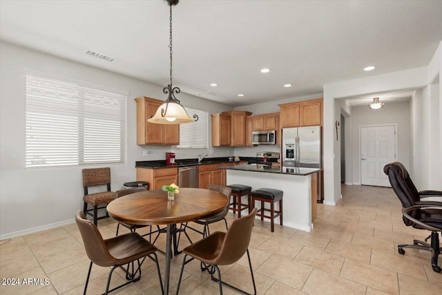 tiled dining space with sink