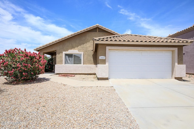 10334 E Diamond Ave, Mesa, AZ 85208 - view of front of home with driveway, stucco siding, and an attached garage