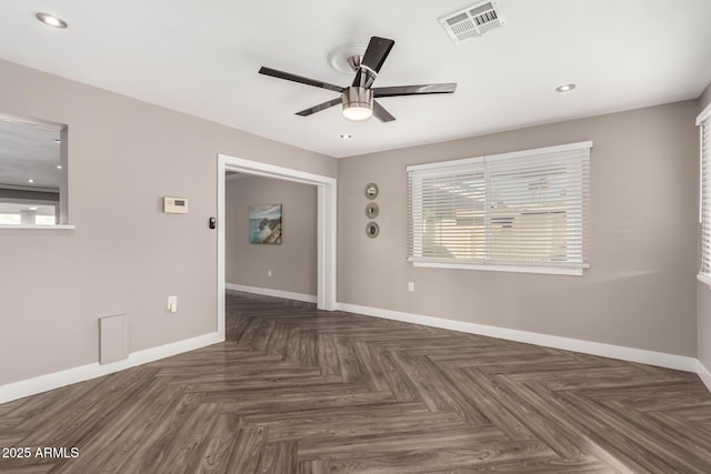 spare room with ceiling fan, recessed lighting, visible vents, and baseboards