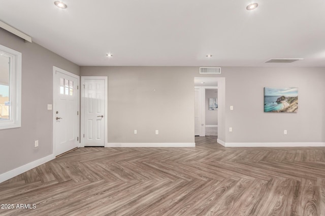 interior space with recessed lighting, visible vents, and baseboards