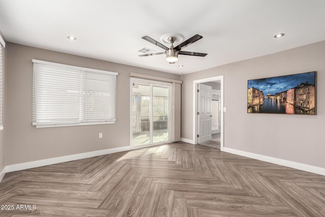 empty room featuring a ceiling fan, recessed lighting, and baseboards