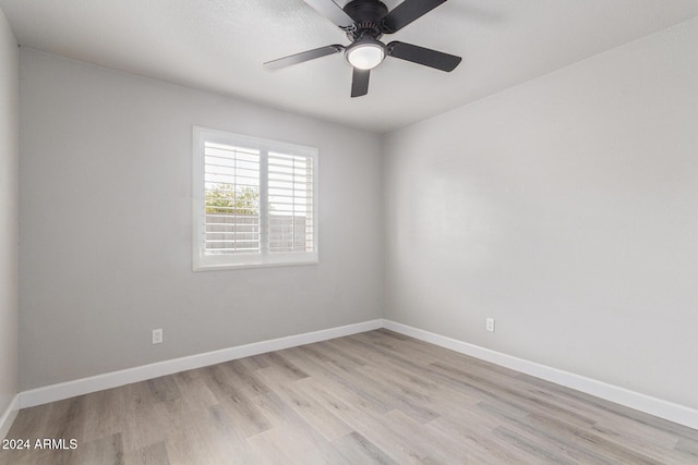 unfurnished room with ceiling fan and light hardwood / wood-style floors