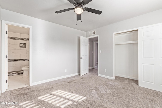 unfurnished bedroom featuring connected bathroom, ceiling fan, a closet, and light colored carpet