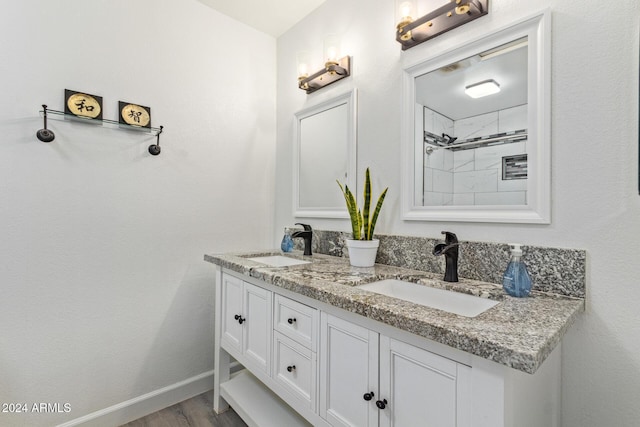 bathroom with hardwood / wood-style floors and vanity