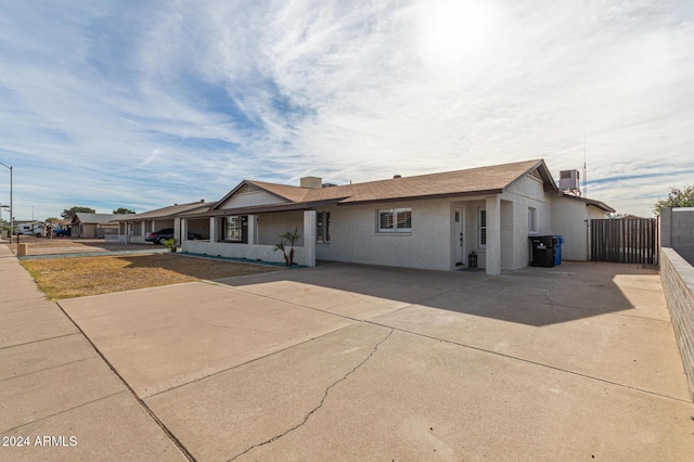 view of front of home featuring cooling unit