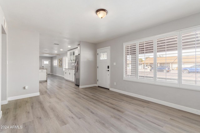 foyer entrance featuring light wood-type flooring