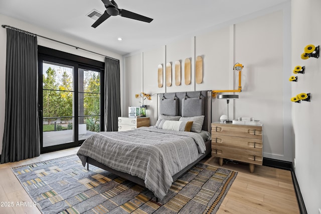 bedroom featuring ceiling fan, light hardwood / wood-style floors, and access to outside