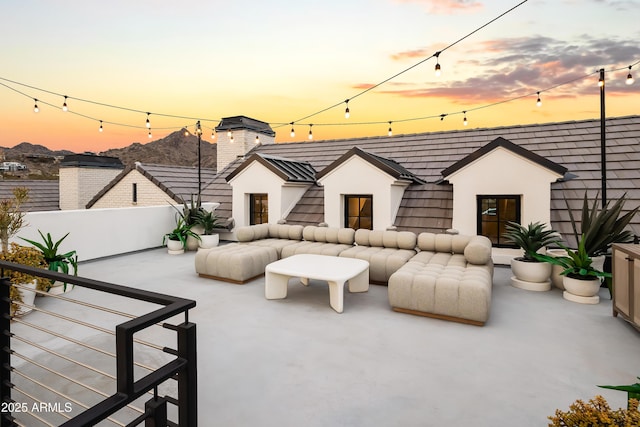 patio terrace at dusk with an outdoor hangout area