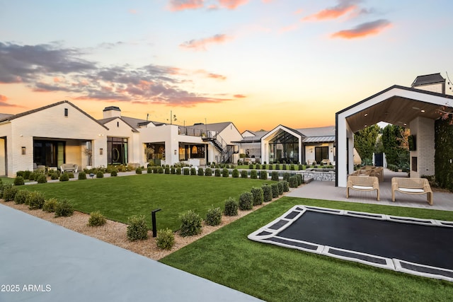 view of home's community with a lawn