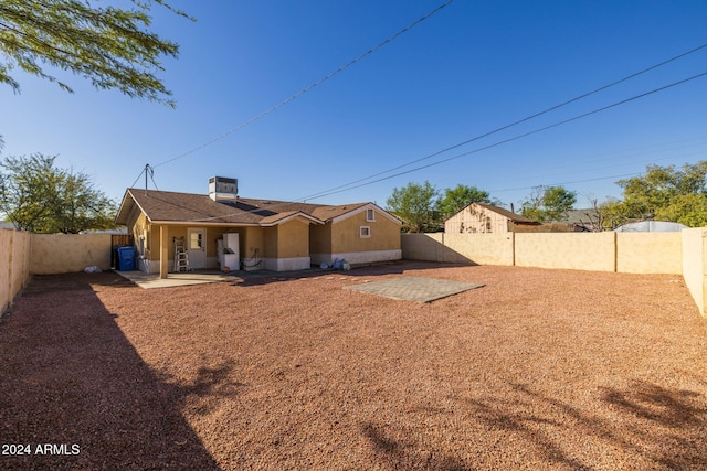 3140 W Alvarado Rd, Phoenix, AZ 85009 - back of house featuring a fenced backyard, stucco siding, and a patio