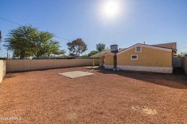 view of yard featuring central air condition unit and a patio