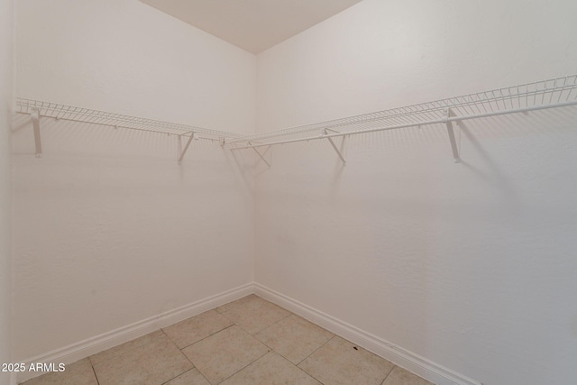 3140 W Alvarado Rd, Phoenix, AZ 85009 - spacious closet featuring light tile patterned flooring