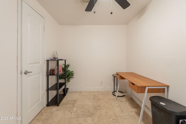 3140 W Alvarado Rd, Phoenix, AZ 85009 - office area with a ceiling fan and light stone finish floors