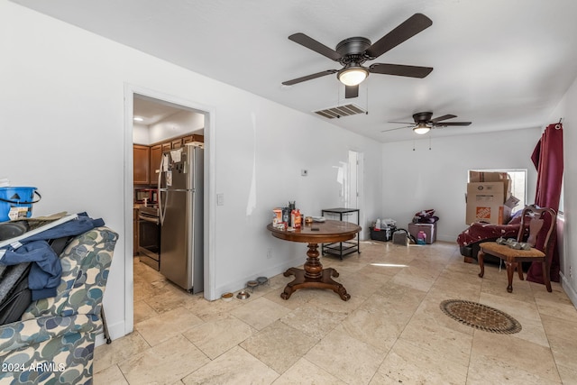 sitting room featuring ceiling fan