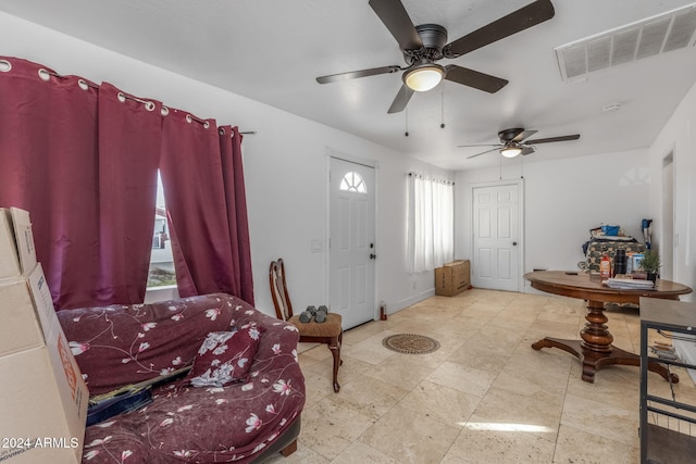 foyer featuring ceiling fan and plenty of natural light