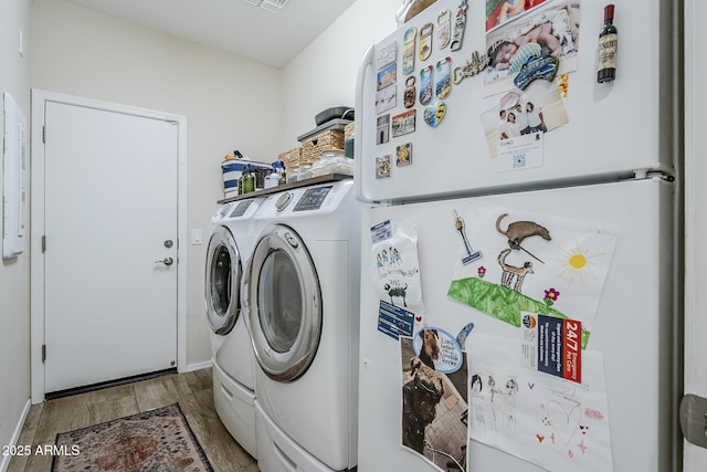 5759 W Saratoga Ct, Florence, AZ 85132 - washroom with washer and clothes dryer, wood finished floors, and baseboards