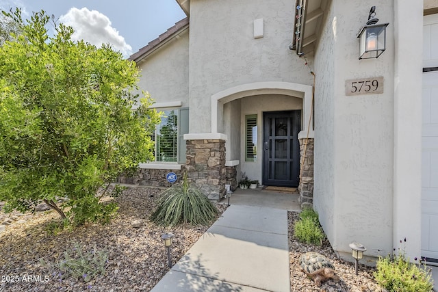5759 W Saratoga Ct, Florence, AZ 85132 - entrance to property featuring stone siding and stucco siding