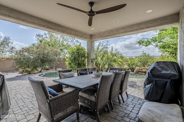5759 W Saratoga Ct, Florence, AZ 85132 - view of patio featuring area for grilling, a fenced backyard, ceiling fan, and outdoor dining space