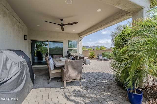 5759 W Saratoga Ct, Florence, AZ 85132 - view of patio with a grill, outdoor dining area, ceiling fan, and fence