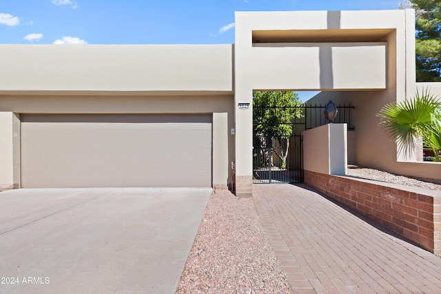 pueblo-style house with a garage