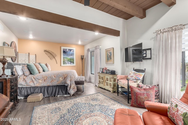 bedroom featuring hardwood / wood-style flooring, beam ceiling, and wooden ceiling