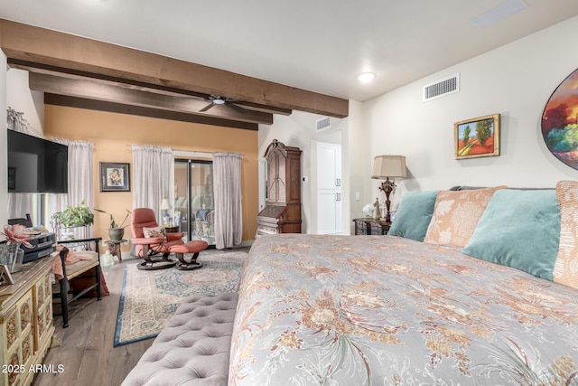 bedroom featuring light wood-type flooring, access to outside, and beam ceiling