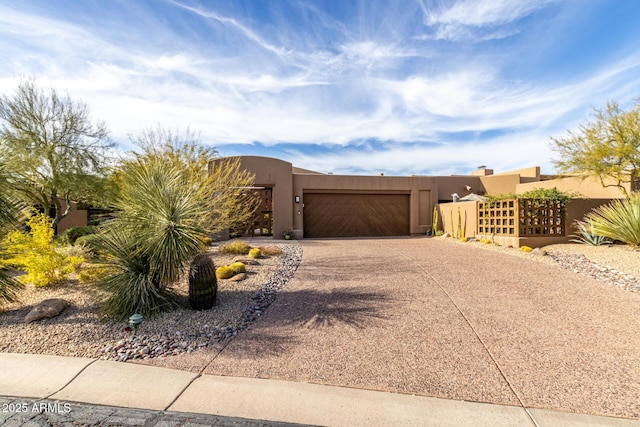 southwest-style home with a garage