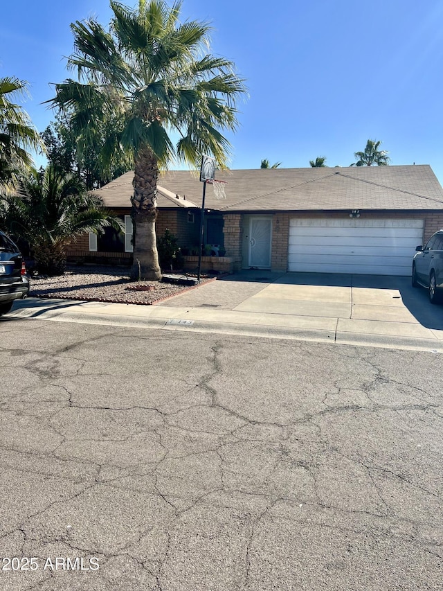 single story home with a garage