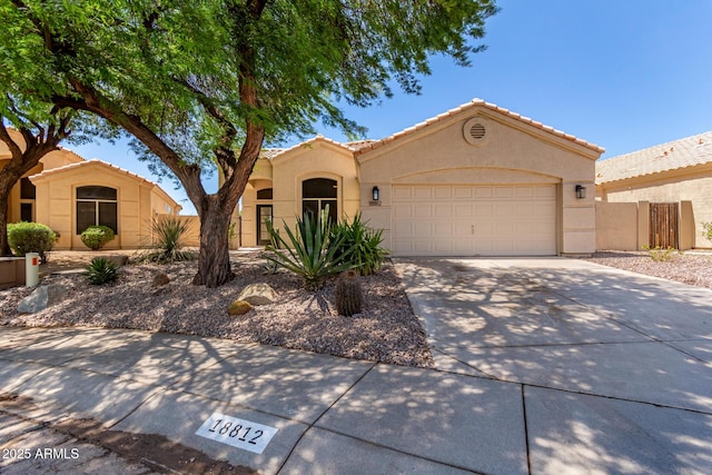 18812 N 90th Pl, Scottsdale, AZ 85255 - mediterranean / spanish-style house featuring stucco siding, a garage, concrete driveway, and a tile roof