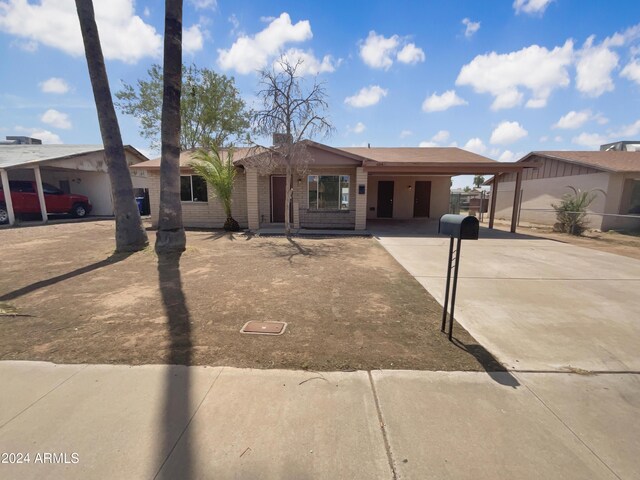 single story home with a carport