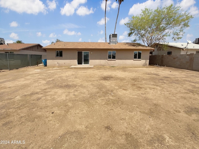 back of house featuring central AC unit