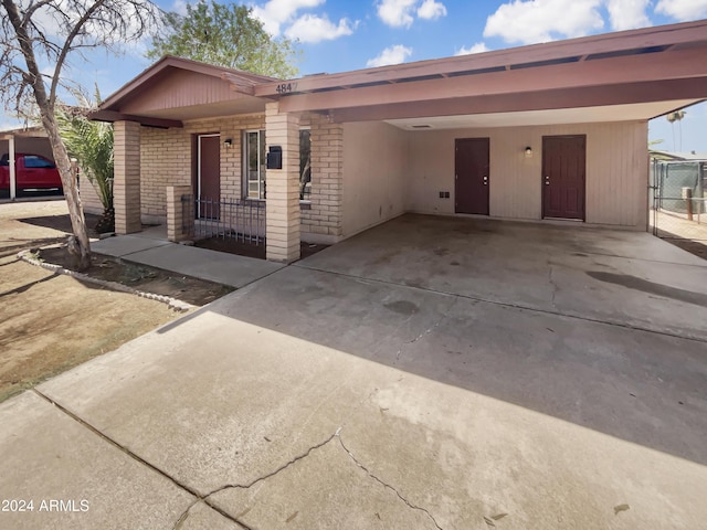 view of front of home featuring a carport