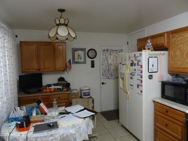 kitchen featuring light tile patterned floors, white fridge with ice dispenser, black microwave, and brown cabinets