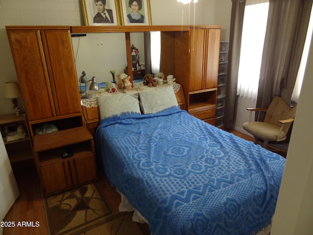 bedroom featuring wood finished floors