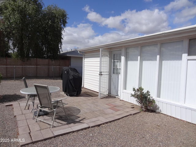 view of patio / terrace with fence and area for grilling