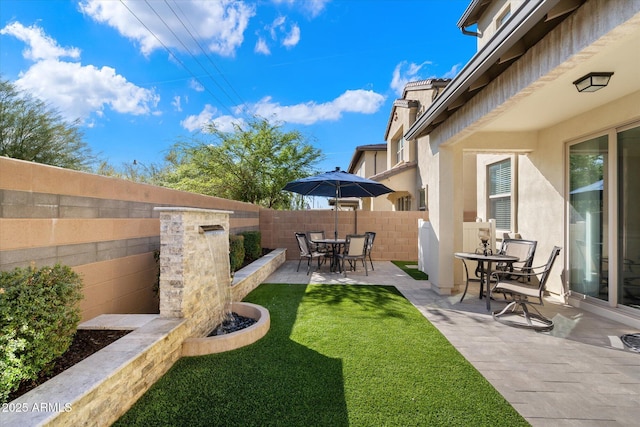 view of yard with a fenced backyard and a patio