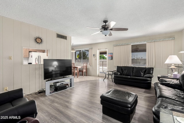 3901 W Augusta Ave, Phoenix, AZ 85051 - living area featuring a ceiling fan, a textured ceiling, and wood finished floors