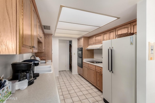 3901 W Augusta Ave, Phoenix, AZ 85051 - kitchen with black appliances, light countertops, under cabinet range hood, and light tile patterned floors