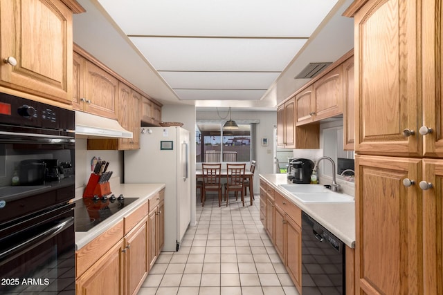 3901 W Augusta Ave, Phoenix, AZ 85051 - kitchen with a sink, black appliances, light tile patterned flooring, and light countertops