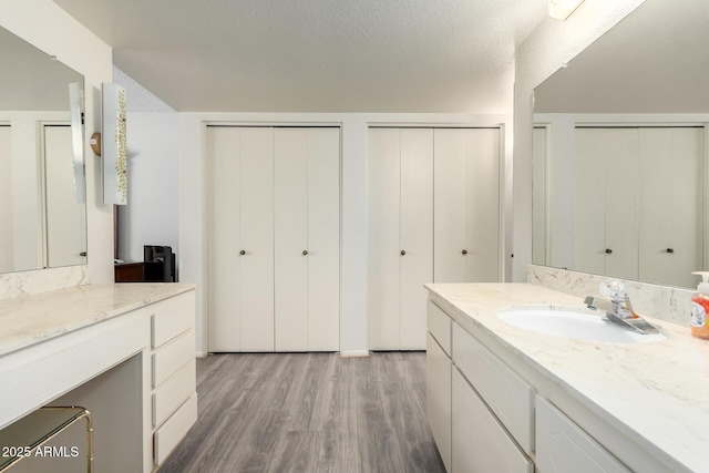 3901 W Augusta Ave, Phoenix, AZ 85051 - bathroom featuring wood finished floors and vanity