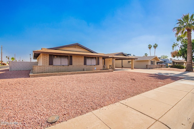 3901 W Augusta Ave, Phoenix, AZ 85051 - single story home with fence, concrete driveway, and brick siding