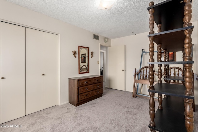 3901 W Augusta Ave, Phoenix, AZ 85051 - bedroom featuring carpet floors, a closet, and a textured ceiling