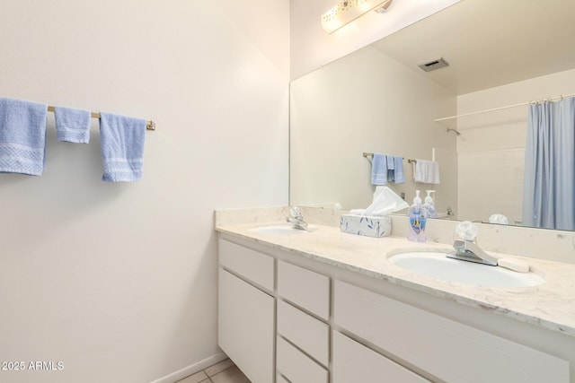 3901 W Augusta Ave, Phoenix, AZ 85051 - full bathroom with double vanity, tile patterned flooring, and a shower with shower curtain